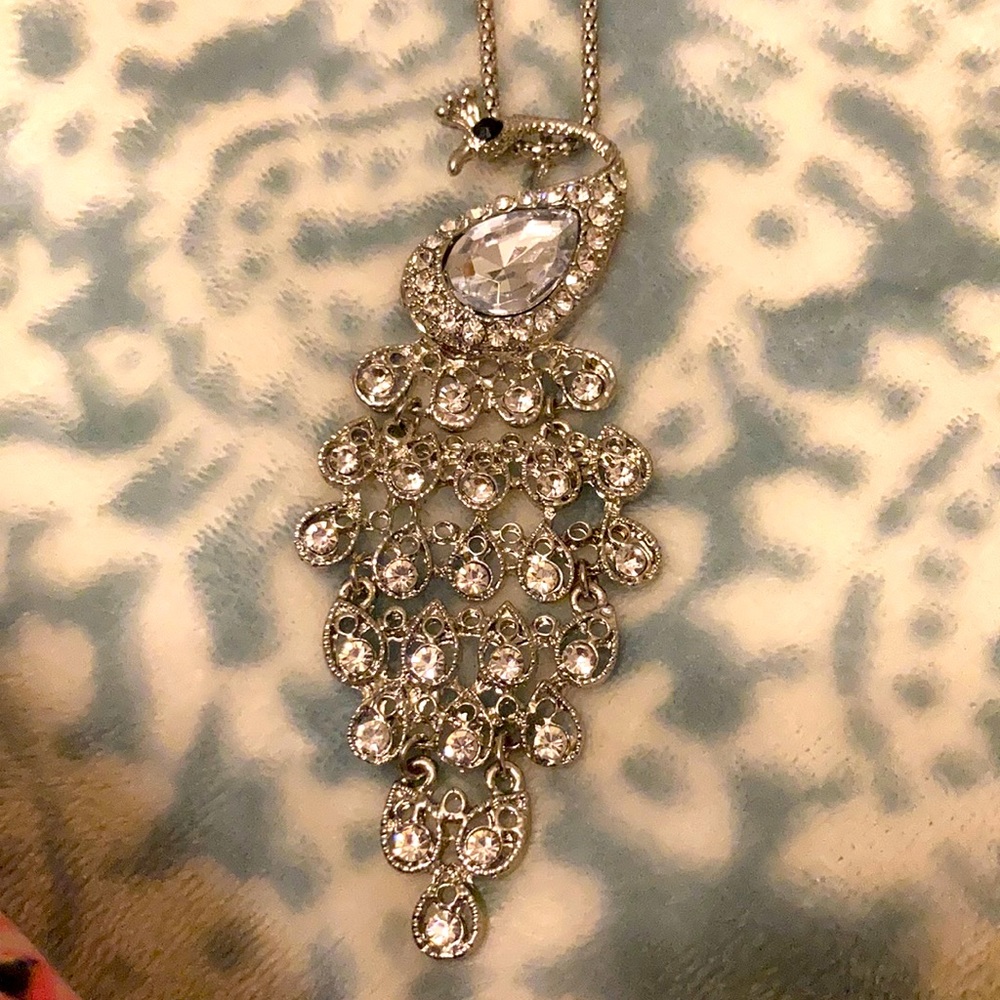 Silver and rhinestones peacock long necklace.